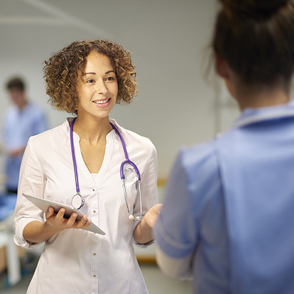 Doctor carrying a tablet